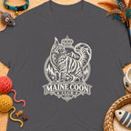 Grey t-shirt with a cream graphic of a Maine Coon cat, mountains, and text "MAINE COON CLUB".