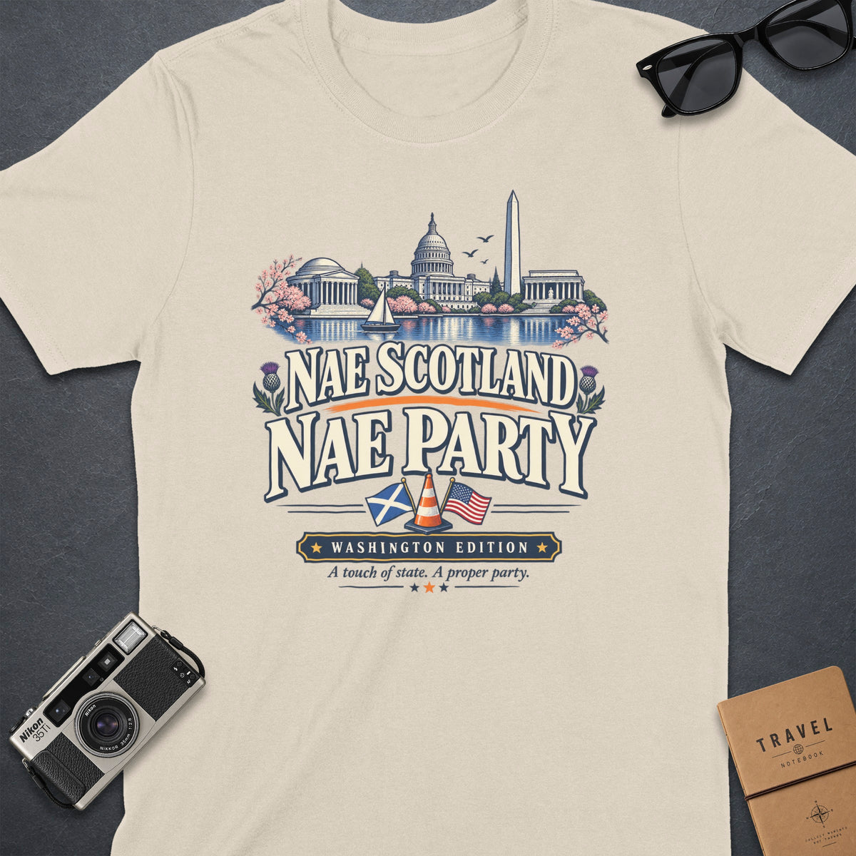 T-shirt with Washington D.C. landmarks, Scotland, and USA flags, and text.