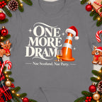 Grey t-shirt with "One More Dram" text, traffic cone with Santa hat, whisky glass.