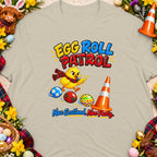 Chick with whistle and Easter eggs, "Egg Roll Patrol" text, with Scottish theme.
