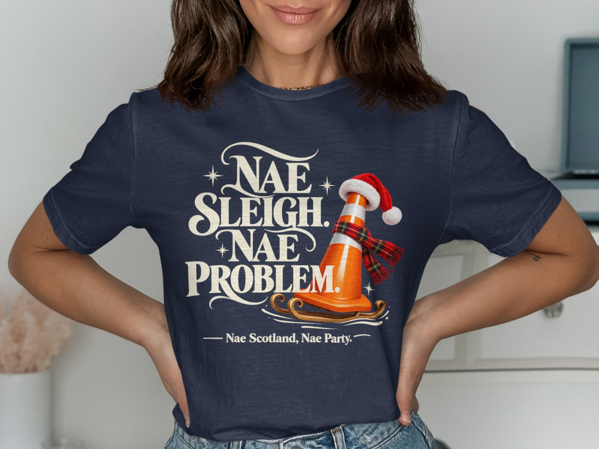 T-shirt with text "Nae Sleigh. Nae Problem!" and a traffic cone with Santa hat.