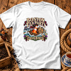 A white t-shirt featuring a graphic with a traffic cone in a rowboat, reading Boston Tea Party and Nae Scotland, Nae Party.