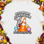 T-shirt with cartoon rabbit, traffic cone, and "Egg Hunt Champion" text.