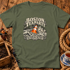 Military green t-shirt with a graphic of a Boston Tea Party ship and an orange traffic cone.