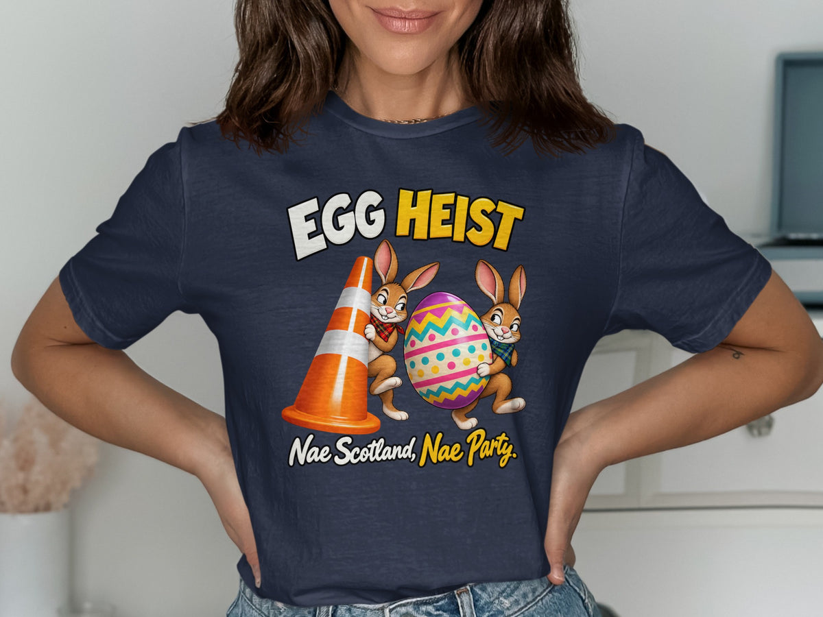 Two cartoon bunnies carry a colorful Easter egg and a traffic cone with text "EGG HEIST" and "Nae Scotland, Nae Party."