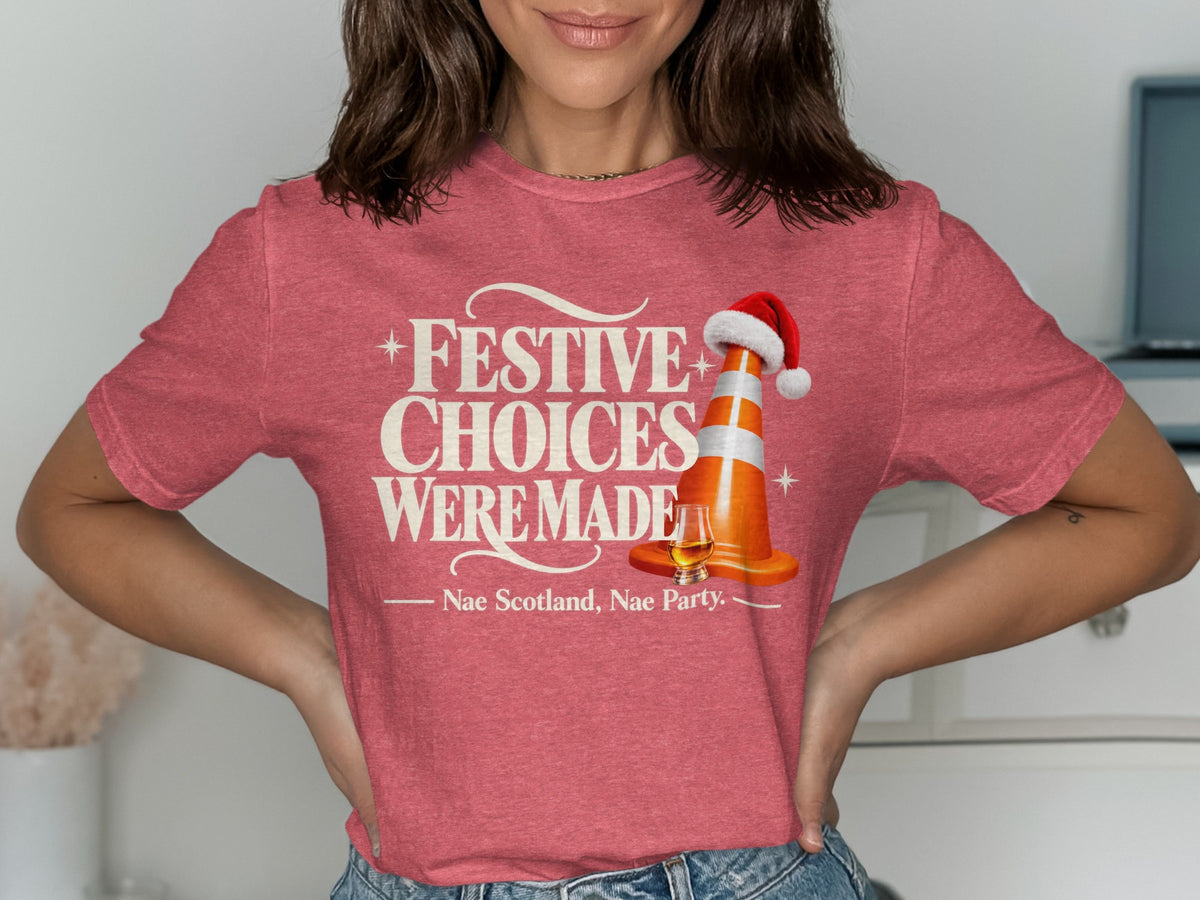 Pink t-shirt with "Festive Choices Were Made Nae Scotland, Nae Party" text and a traffic cone.