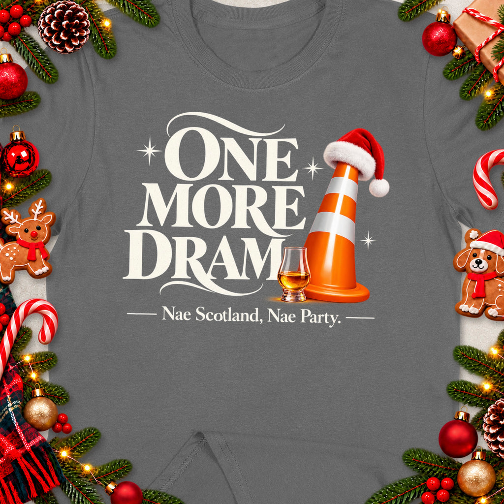 Grey t-shirt with "One More Dram" text, a whiskey glass, and Christmas decorations.