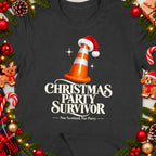 T-shirt with "Christmas Party Survivor" text and a traffic cone in a Santa hat.