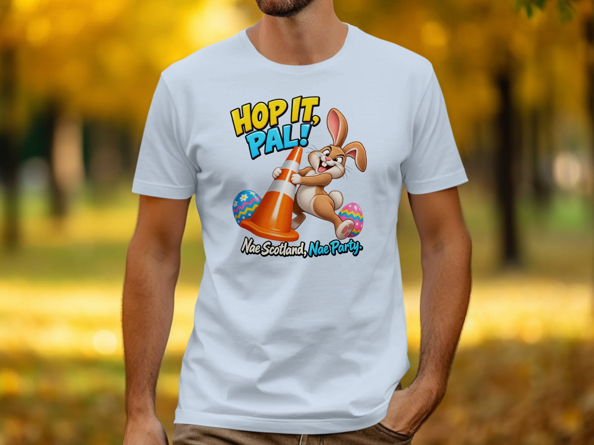 T-shirt with a cartoon bunny, traffic cone, and Easter eggs with text "Hop It, Pal!".