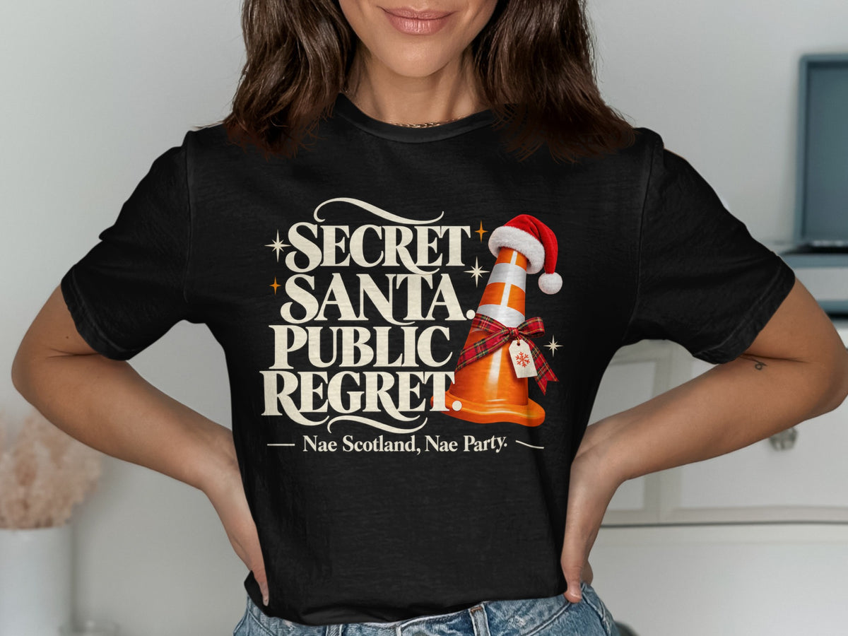 Black t-shirt with "SECRET SANTA. PUBLIC REGRET." text and a traffic cone.