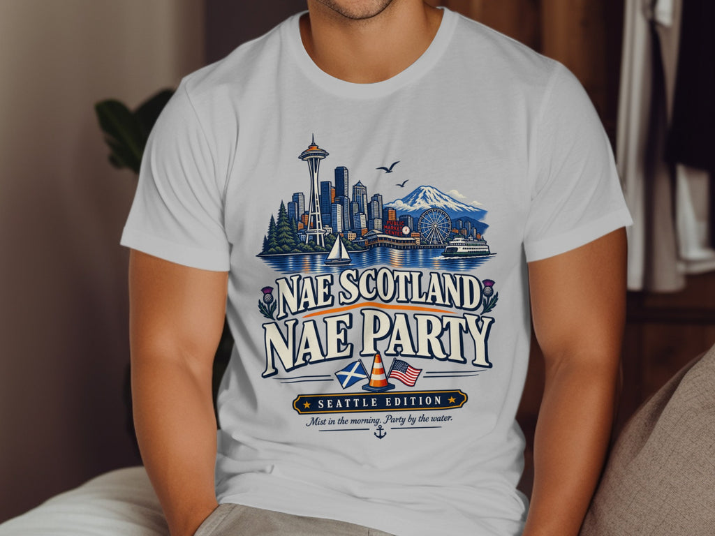 White t-shirt with Seattle skyline, "Nae Scotland NAE PARTY SEATTLE EDITION" text.