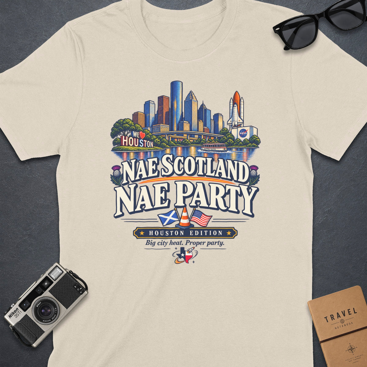 Cream t-shirt with Houston skyline graphic, "Nae Scotland Nae Party" text, and Texas rocket.