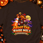 A Scottish pumpkin character on a dark shirt with "Aboot Tae Raise Hell" text.