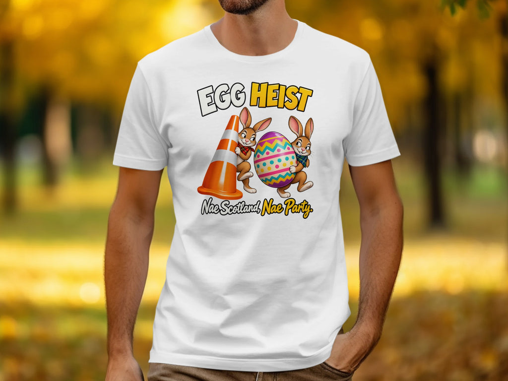 White t-shirt with cartoon bunnies, traffic cone, and "Egg Heist" text.