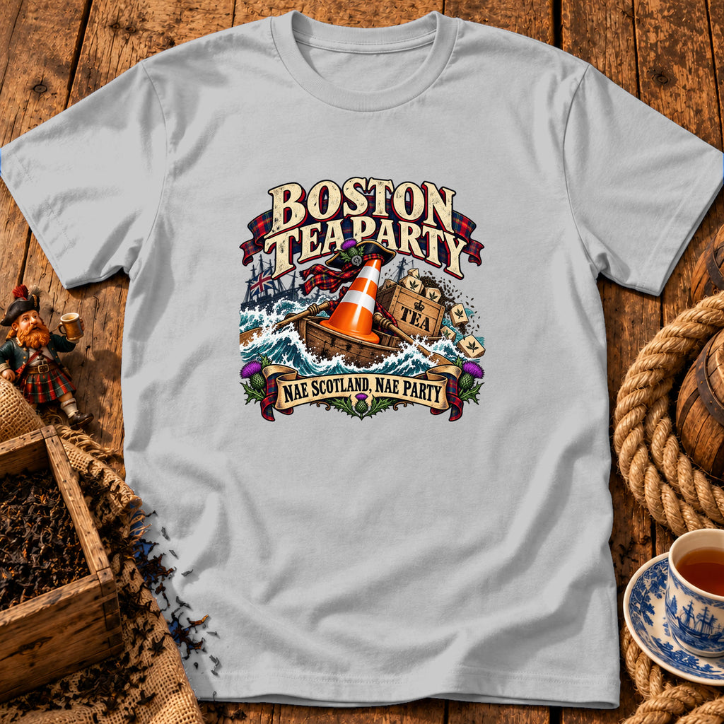 Light gray t-shirt featuring a humorous graphic of a boat with a traffic cone and tea crates in rough seas, with text reading Boston Tea Party and Nae Scotland, Nae Party.