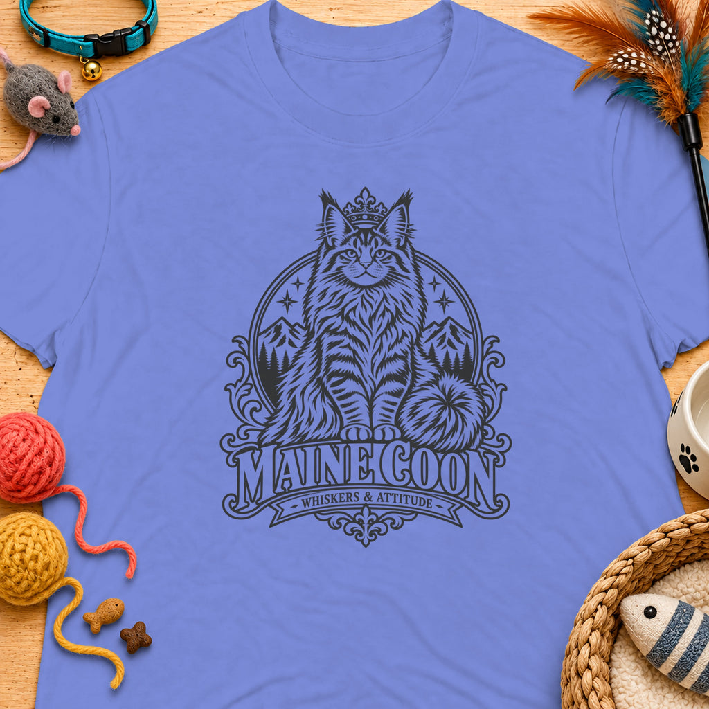 Maine Coon cat graphic with mountains and crown on a lavender t-shirt.