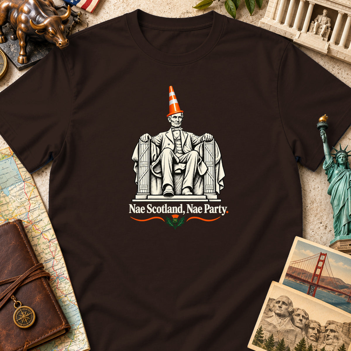 A brown t-shirt featuring a graphic of Abraham Lincoln wearing a traffic cone with the text Nae Scotland, Nae Party.
