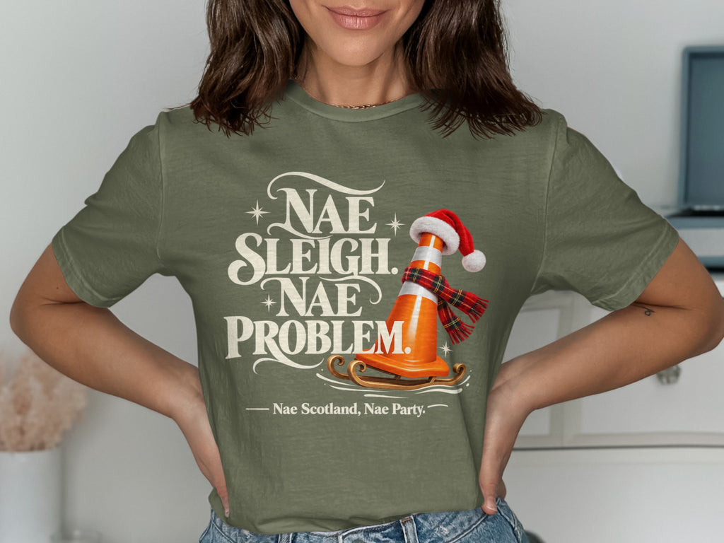 Green t-shirt with text "Nae Sleigh. Nae Problem." and a traffic cone on a sled.