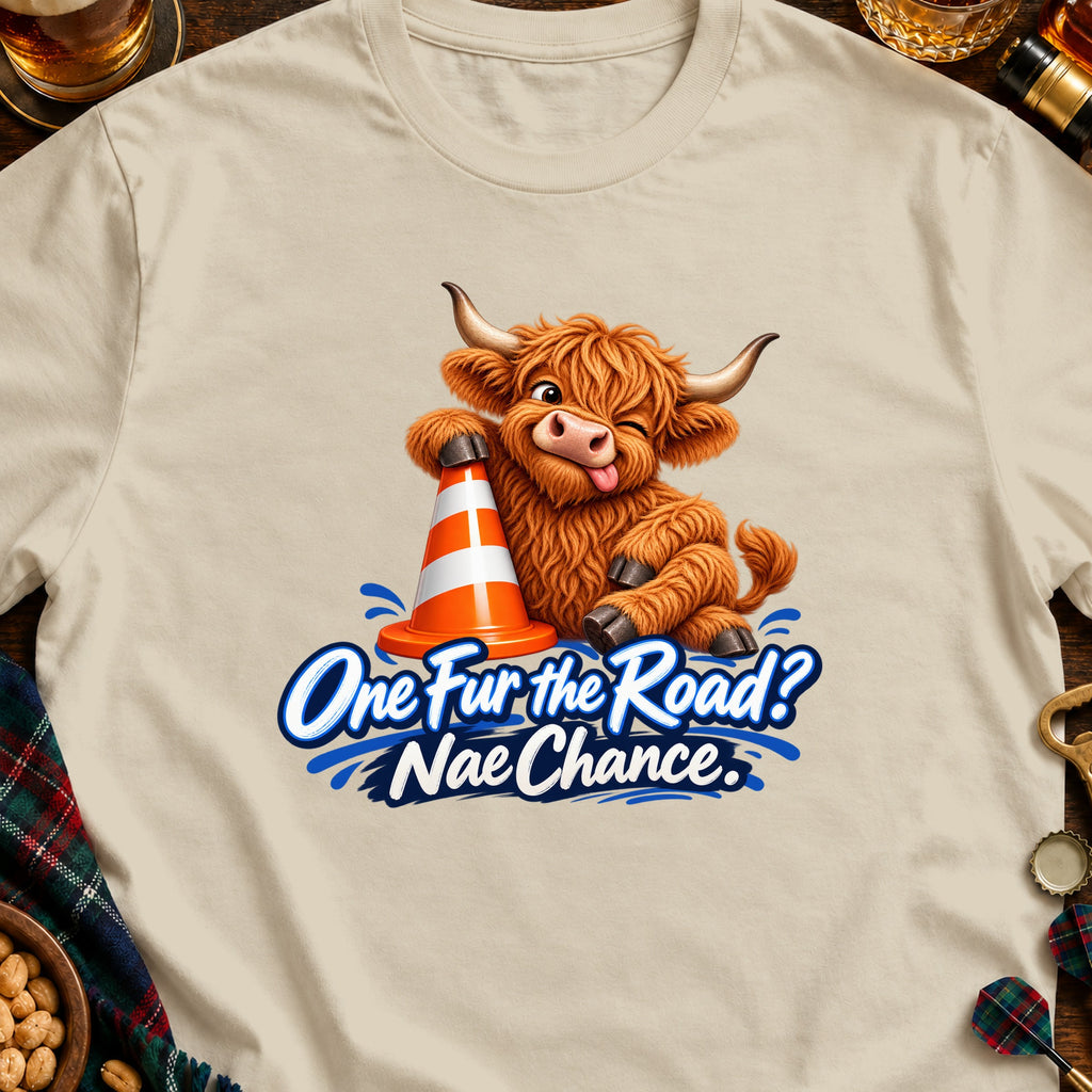 Fluffy Highland cow with traffic cone and text "One Fur the Road? Nae Chance."